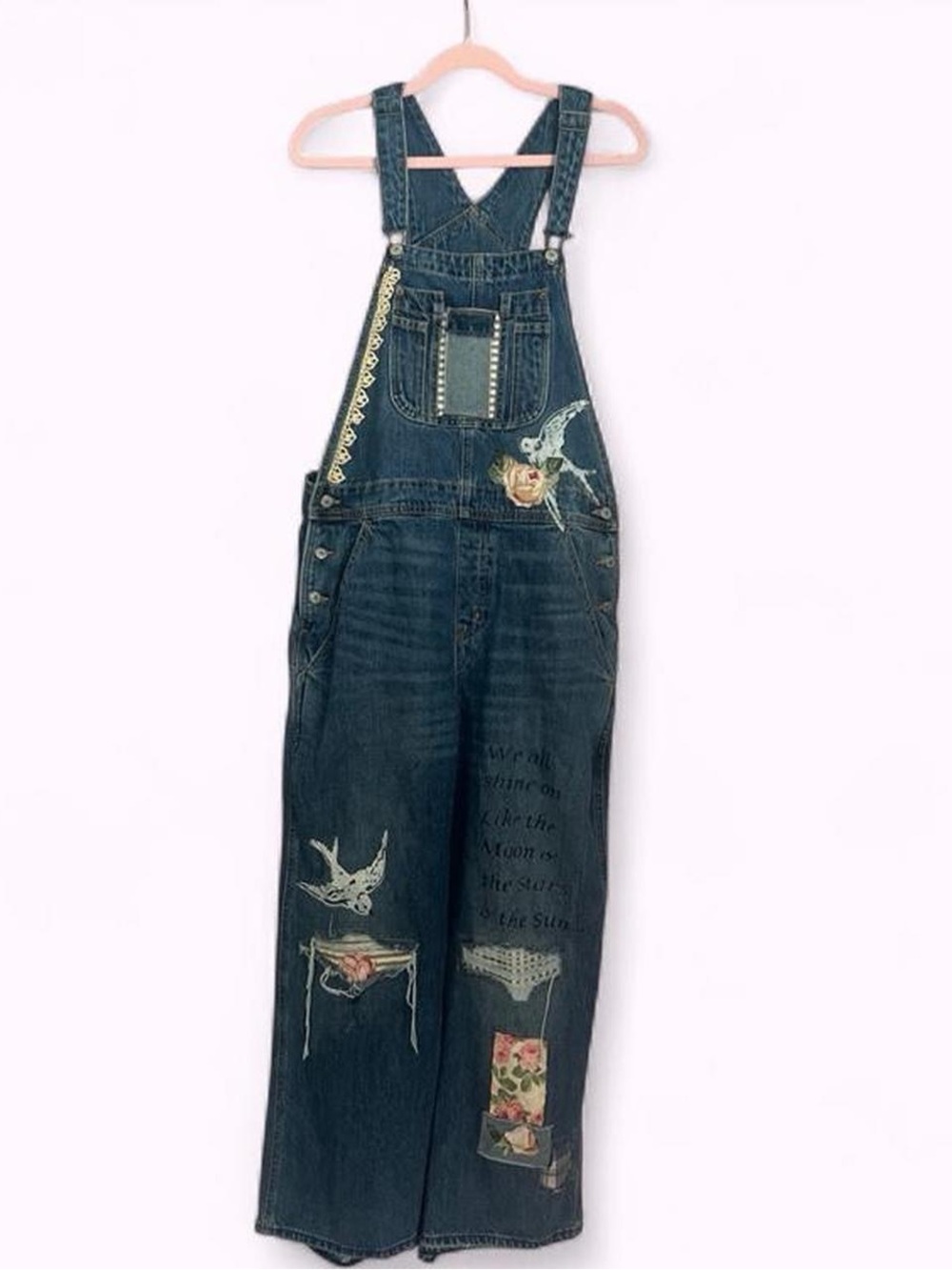 Hand altered blue denim overalls with floral and bird appliqués
